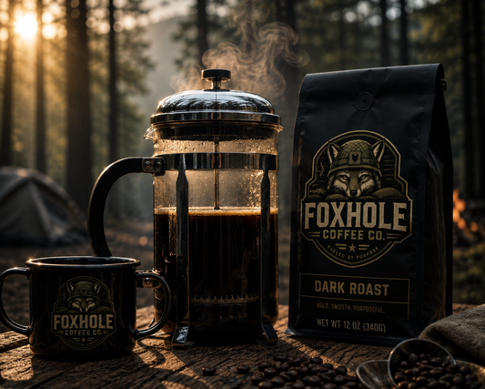 French press and Foxhole Coffee Dark Roast at a forest campsite