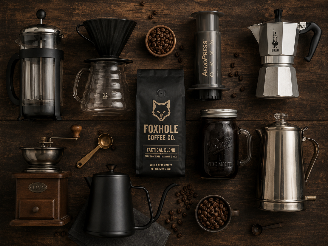 Foxhole Coffee Tactical Blend bag surrounded by every brew tool — French press, pour-over, Aeropress, Moka pot, hand grinder, gooseneck kettle, cold brew mason jar, and percolator on dark wood