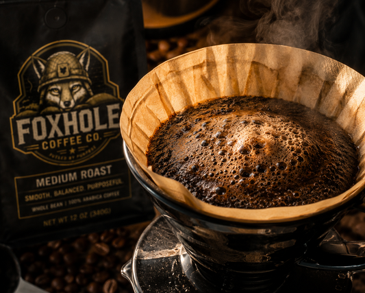 Foxhole Coffee Medium Roast blooming vigorously in a pour-over filter with steam rising