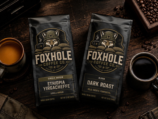 Foxhole Coffee Ethiopia Yirgacheffe single origin and Dark Roast blend bags side by side on dark wood